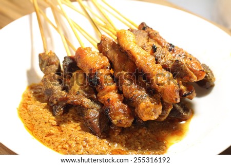 Satay is a Malaysian-style kebab. It is served with a peanut sauce, and slivers of cucumbers and onions.