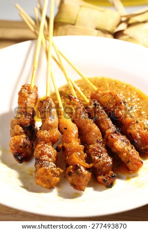 Satay is a Malaysian-style kebab. It is served with a peanut sauce, and slivers of cucumbers and onions.