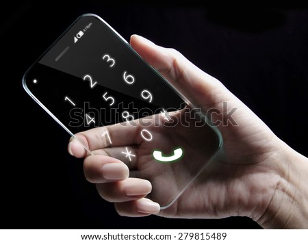 Hand and futuristic transparent smartphone isolated on black background. The most promising technologies in the mobile market is flexible and transparent displays.