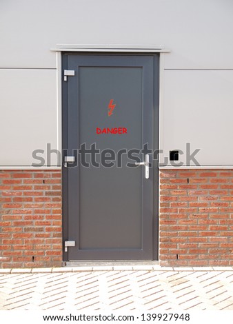 metal door with text danger and access control system