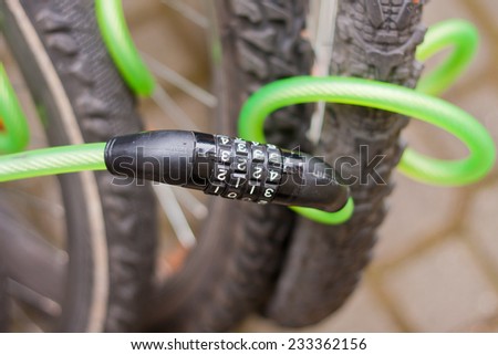 Securing a bike  with an anti-theft code-lock.