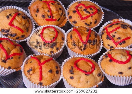 Muffins, chocolate muffins decorated with chocolate and  inscriptions