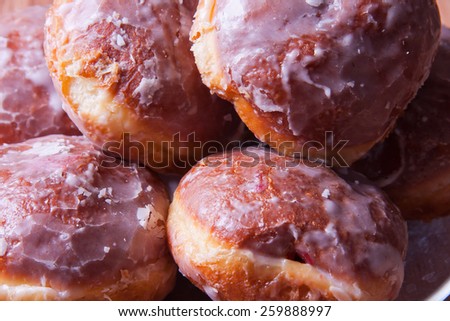 Delicious donuts stuffed with jam with an icing-sugar coat