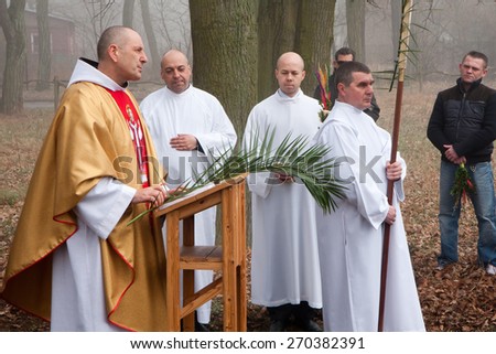 Otwock, Poland- March 29, 2015: Palm Sunday in a Polish church. The faithful gathered in front of the church with  traditional palm branches