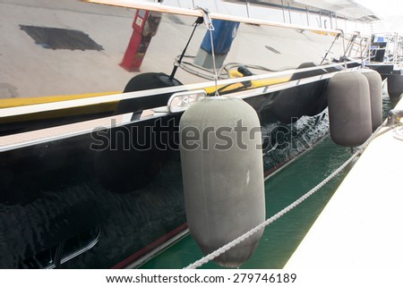The yachts port. Mooring buoys attached to the side of an elegant yacht.