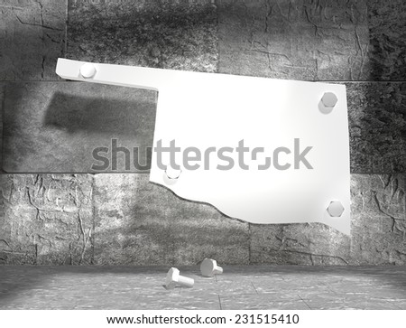 concrete blocks empty room with clear outline oklahoma state map attached to wall by bolts