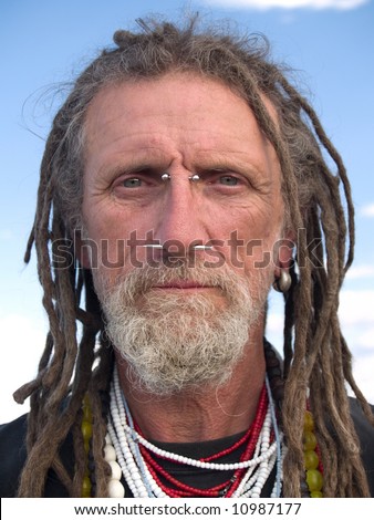 face piercings types. stock photo : Eccentric handsome gentleman with facial piercings