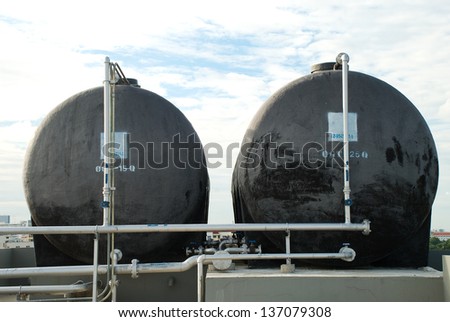 black water tanks with gray pipe lines