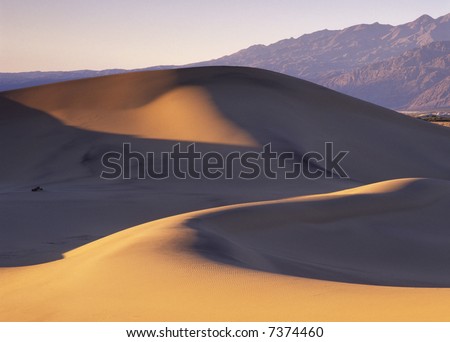 Smooth sand dunes in Death Valley at the beginning of a dust storm