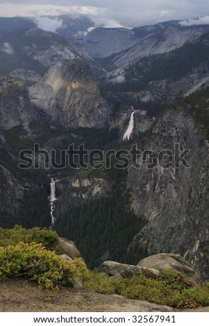 View of Merced River waterfalls on a stormy evening from Glacier Point in Yosemite National Park, California