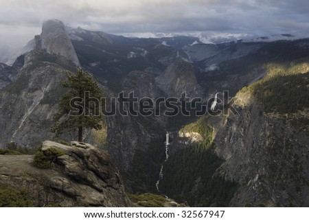 View of Half Dome and waterfalls from Glacier Point in Yosemite National Park, California