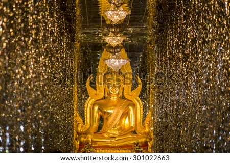 Golden buddha statue at cathedral glass.  Places of worship.