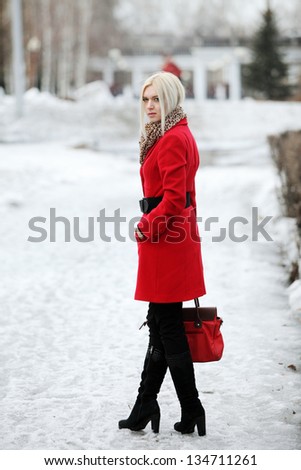 beautiful girl in a red coat