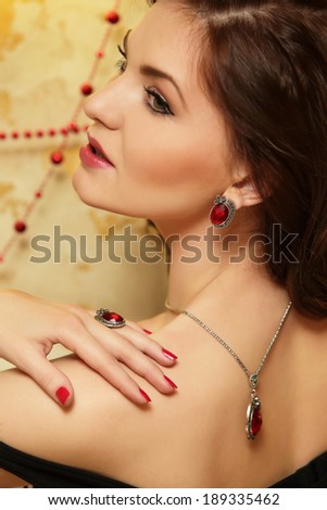 Portrait of a beautiful girl in a beautiful fashion jewelry at the neck