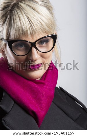Portrait of a beautiful blonde business business wear glasses