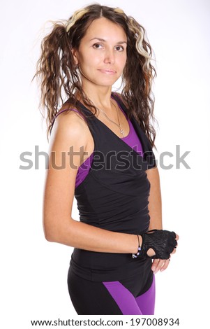 beautiful brunette in sportswear for fitness on a light background