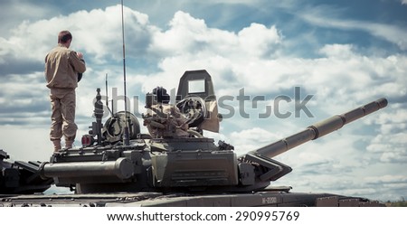 Premium Photo  Modern battle tank in a camouflage masking net isolated on  a white background