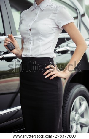 attractive young woman in the car with the keys