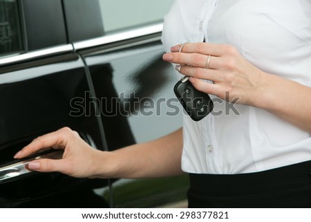attractive young woman in the car with the keys
