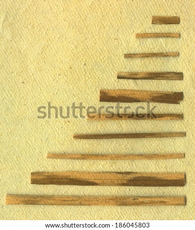 Set of sticks in order on beige old paper background
