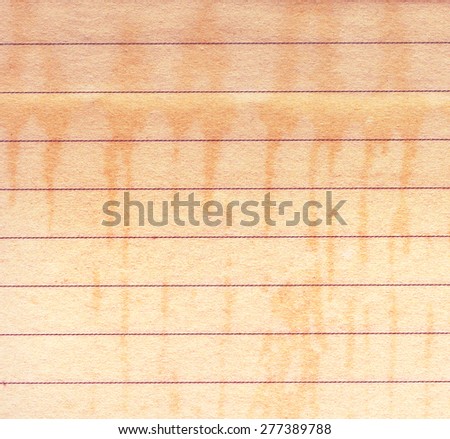 Old stained note paper with rules. Recycled paper background