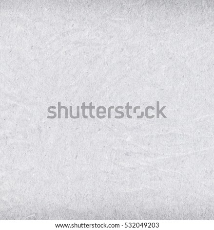 Recycled grainy creased off white paper texture background