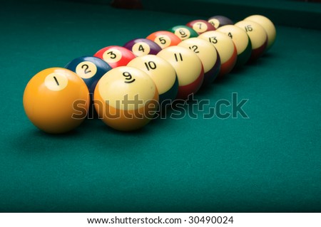 Billiard balls arranged in order from one to fifteen, shallow depth of field
