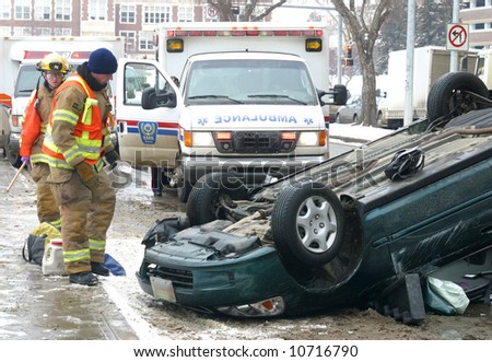Emergency workers respond to a single vehicle rollover.