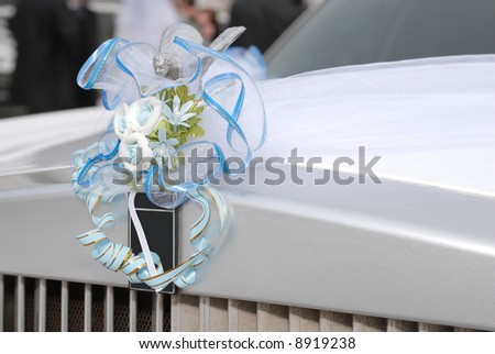 Decoration on the white wedding limousine
