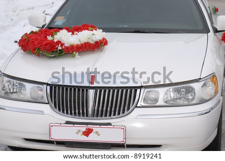 White wedding limousine with red heart
