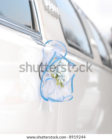 White wedding limousine decoration with flowers