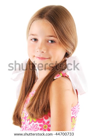 Little girl with bows posing on white background