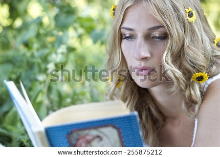 Girl\'s reading in the nature.