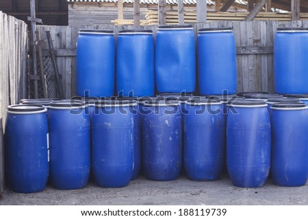 Big old blue plastic barrels