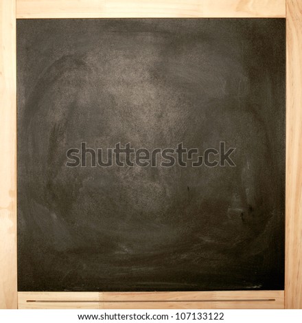 Blank chalkboard in wooden frame isolated on white