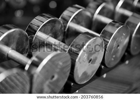 Shot of a set of dumbbells on weight rack with selective focus