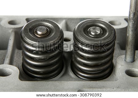 Valve springs mounted on their position on a cylinder head.