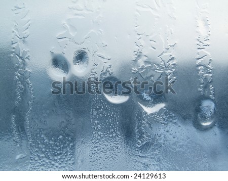 Frozen drops of water on a window pane