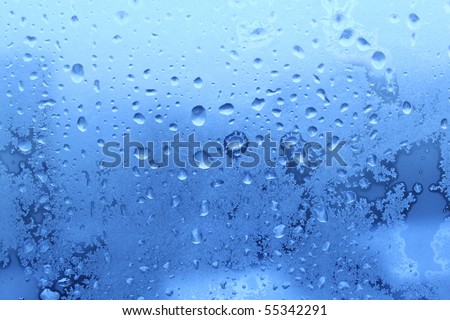 ice water drops on winter glass