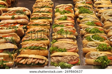 Fresh sandwiches with shrimp, herring, tomato, lettuce salad, pate, cucumber and onion