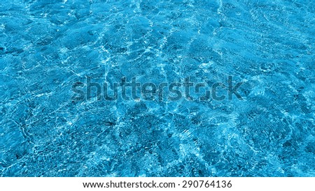 Natural background of transparent blue sea water