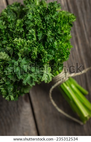 Garden parsley on wooden background