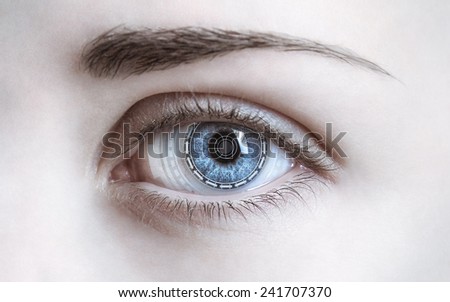 Close-up of woman\'s eye. New technologies and futuristic concept