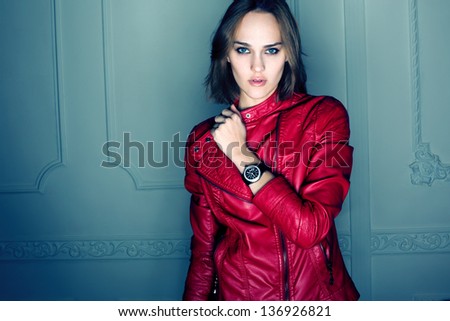Portrait Of Beautiful Sexy Fashion Girl Wearing Red Coat And Black Watch