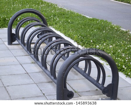 Metal bicycle storing device in a park, close-up