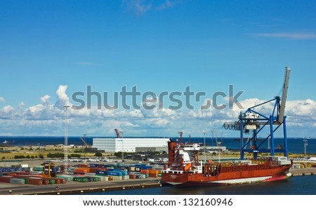 Container terminal and ship berthed in Copenhagen sea port, Denmark.