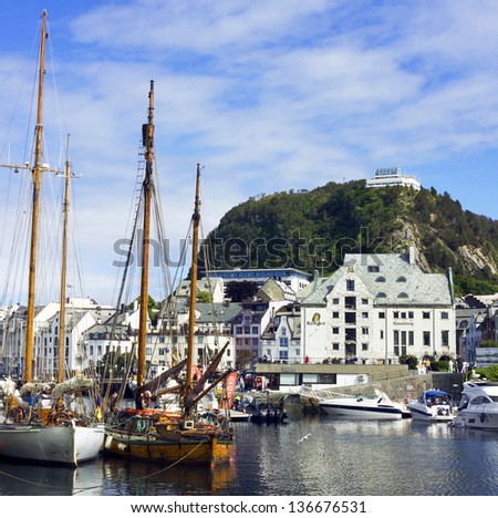 ALESUND, NORWAY: Yachts and Aksla mountain in the center of town Alesund. Alesund is noted for its unique concentration of art nouveau architecture.