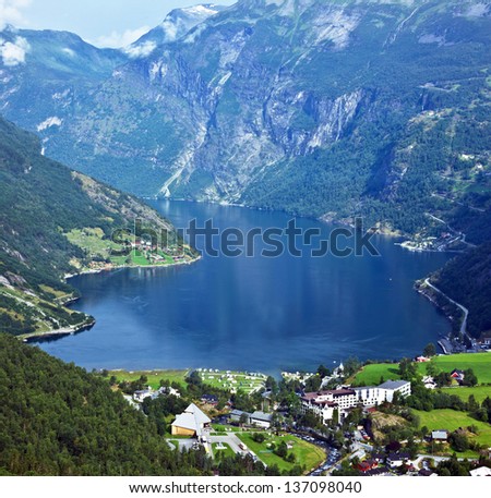 Norway Cruise: Mountains And Village In Geiranger Fjord.