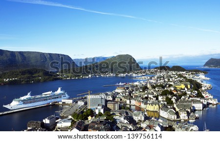 ALESUND, Norway: Cruise ship in Norwegian town Alesund - sea port in Norwegian fjords with Art Nouveau architecture.