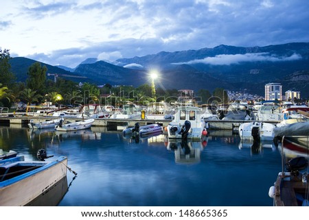 BUDVA, Montenegro: Night view with boats on sea front of Budva in summer season, Montenegro. Budva is the biggest resort and tourist center of Montenegro.